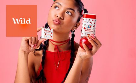 Girl holding wild strawberry and apple products