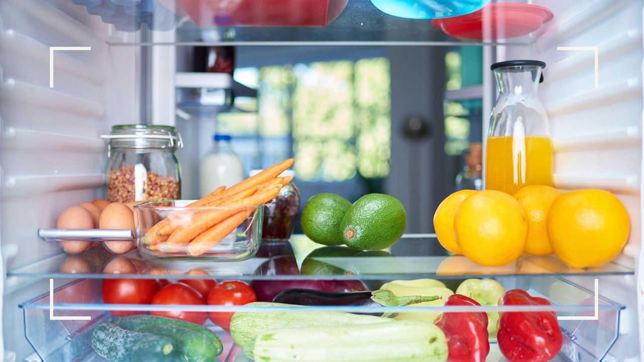 Inside a tidy fridge with grouped ingredients to demonstrate how to organize a fridge for efficiency 