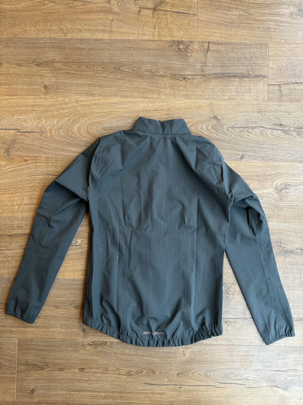 Flatlay reverse jacket showing off sleeves and pockets
