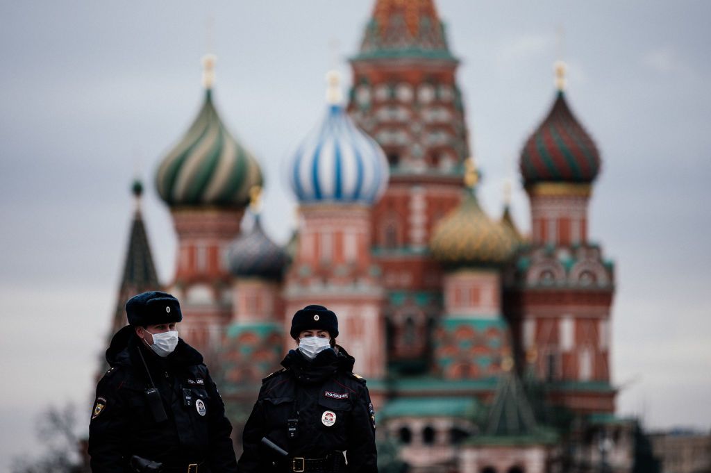 Police officers wear masks in Moscow.