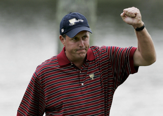 Phil Mickelson celebrates holing a putt at the Presidents Cup