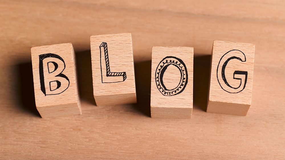 The word &#039;blog&#039; written on wooden blocks to represent learning how to start a blog