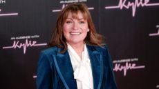 Lorraine Kelly poses for photographers upon arrival for 'An Audience with Kylie' at the Royal Albert Hall
