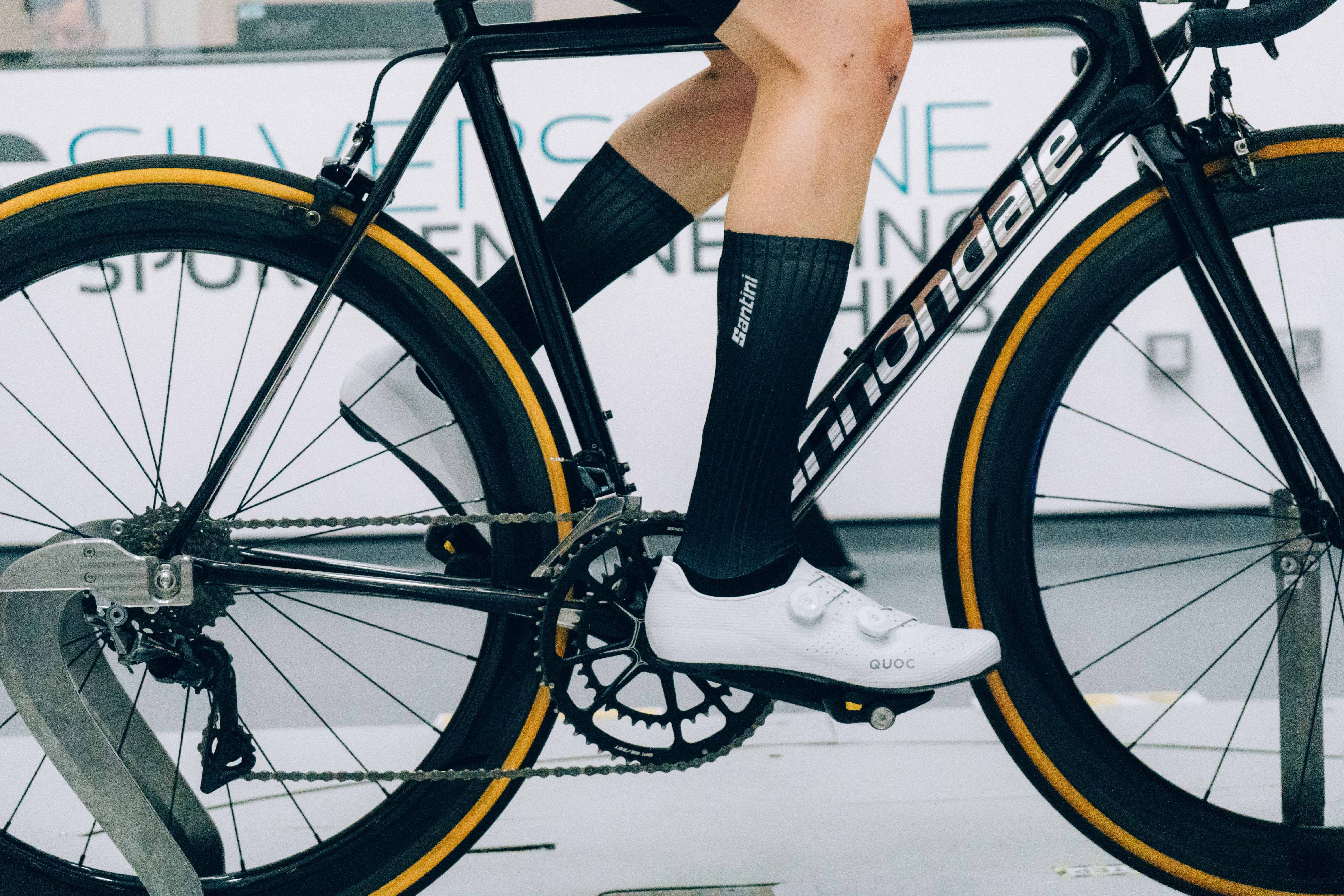 A close up of the socks that Tom is wearing while riding a bike in the wind tunnel