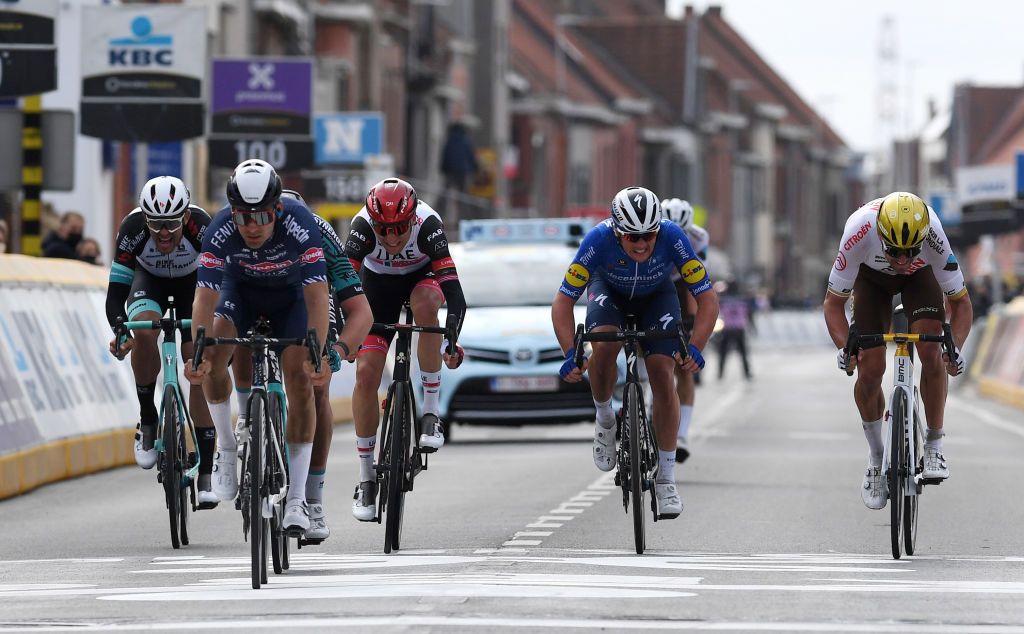 WEVELGEM BELGIUM MARCH 28 Arrival Jack Bauer of New Zealand and Team Team BikeExchange Gianni Vermeersch of Belgium and Team AlpecinFenix Sven Erik Bystrom of Norway and UAE Team Emirates Yves Lampaert of Belgium and Team Deceuninck QuickStep Greg Van Avermaet of Belgium and AG2R Citren Team during the 83rd GentWevelgem in Flanders Fields 2021 Mens Elite a 254km race from Ypres to Wevelgem GWE21 GWEmen FlandersClassic on March 28 2021 in Wevelgem Belgium Photo by Tim de WaeleGetty Images