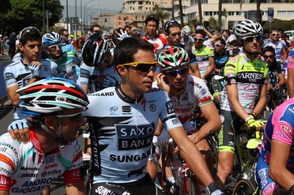 Alberto Contador puts his arm around another rider