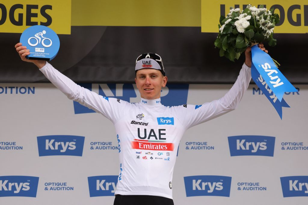 UAE Team Emirates Slovenian rider Tadej Pogacar celebrates on the podium with the best young riders white jersey after the 8th stage of the 110th edition of the Tour de France cycling race 201 km between Libourne and Limoges in central western France on July 8 2023 Photo by Thomas SAMSON AFP Photo by THOMAS SAMSONAFP via Getty Images