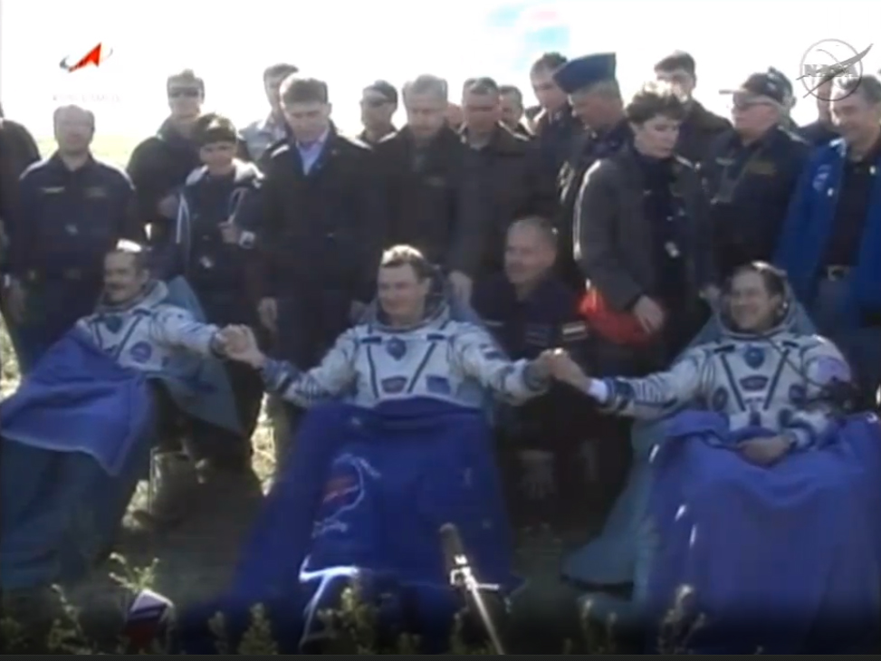 The International Space Station&#039;s Expedition 35 crewmembers pose for a crew photo after landing their Soyuz capsule on the sunny steppes of Kazakhstan on May 14, 2013 (May 13 EDT). From left are: Canadian astronaut Chris Hadfield, Russian cosmonaut Roman 