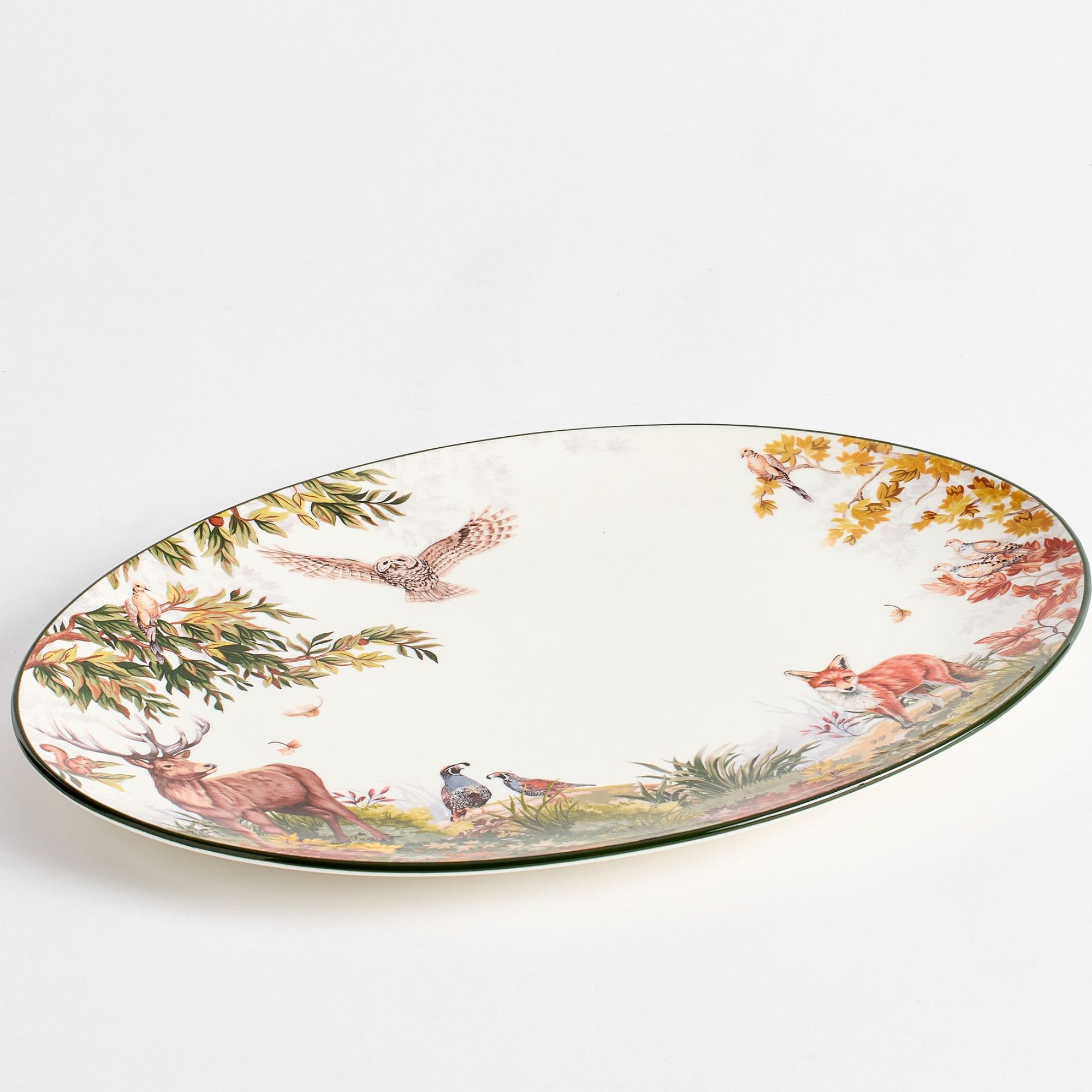 White serving platter with harvest foliage and animal designs