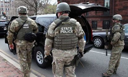 Massachusetts State Police guard an area near Kenmore Square after two bombs exploded during the 117th Boston Marathon on April 15.