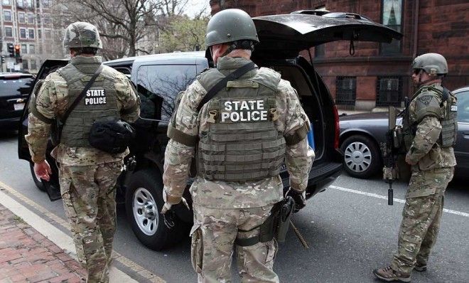 Massachusetts State Police guard an area near Kenmore Square after two bombs exploded during the 117th Boston Marathon on April 15.