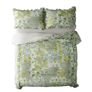 A green duvet cover with ruffles and floral pattern