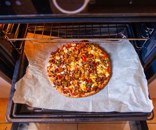 A pizza cooked in an oven