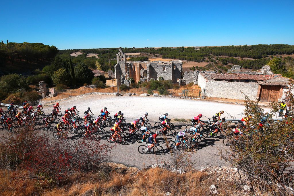 SEGOVIA SPAIN SEPTEMBER 10 A general view of the peloton passing close to the Monasterio de Nuestra Seora de la Armedilla during the 8th Ceratizit Challenge By La Vuelta 2022 Stage 4 a 1604km stage from Palencia to Segovia 1005m CERATIZITChallenge22 UCIWWT on on September 10 2022 in Segovia Spain Photo by Gonzalo Arroyo MorenoGetty Images