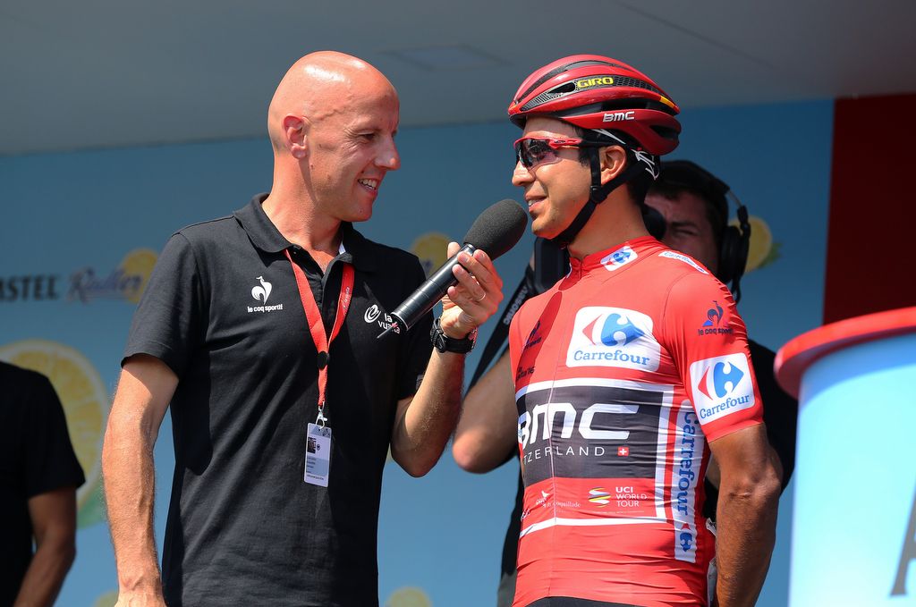 Darwin Atapuma (BMC) in the leader's jersey is interviewed on stage
