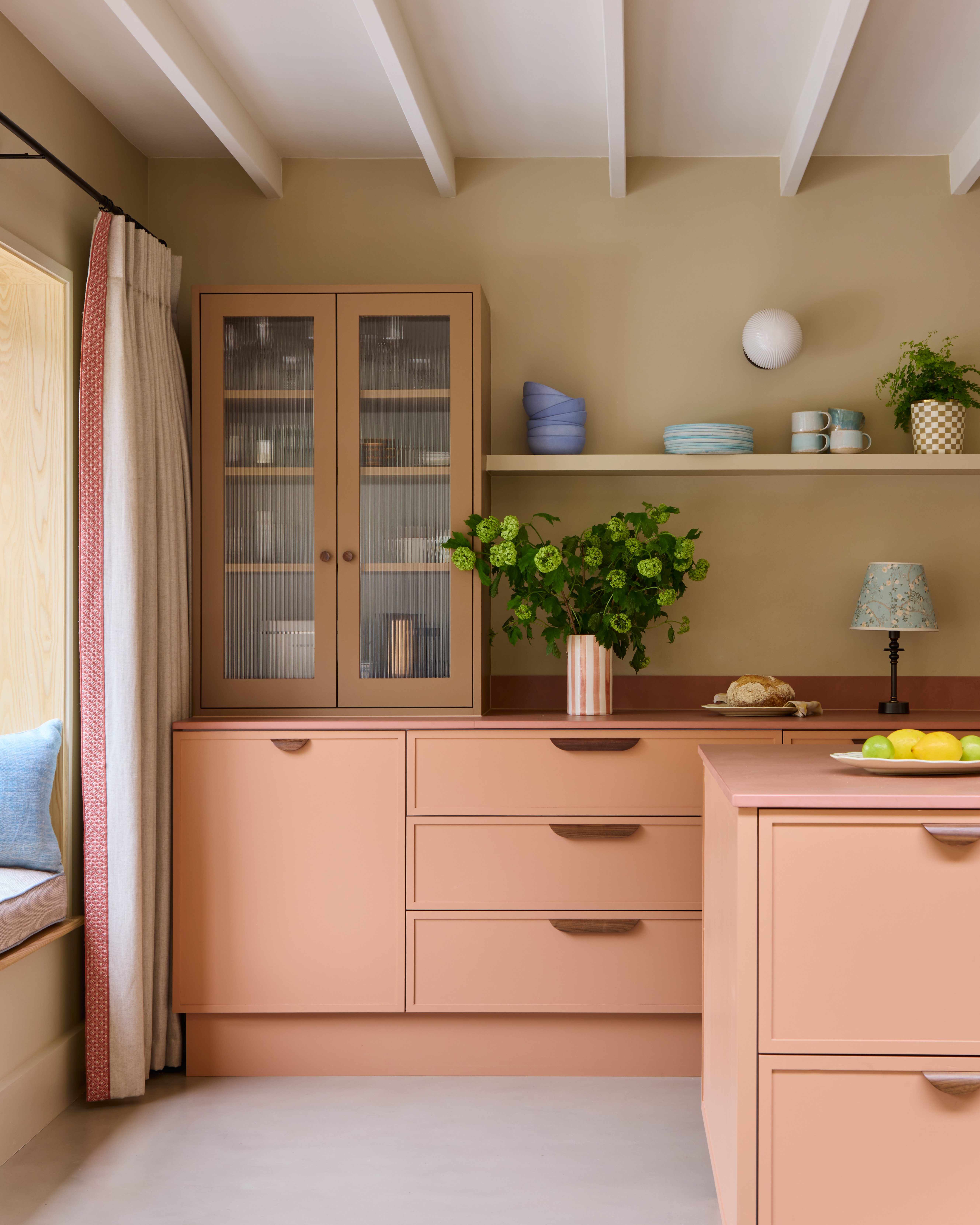 A contemporary kitchen with wooden hardware