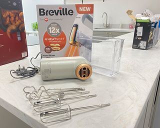Image of Oster HeatSoft Hand Mixer during unboxing process
