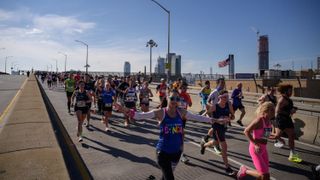 Runners cross the Pulaski bridge as they compete during the 2021 TCS New York City Marathon