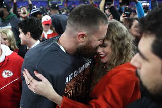 Taylor Swift and Travis Kelce on field after the Chiefs victory on January 28, 2024