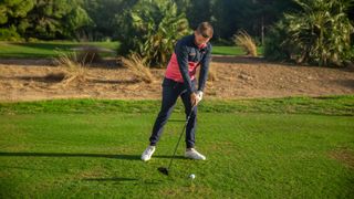 PGA pro Alex Elliott hitting a drive at Infinitum Golf Resort