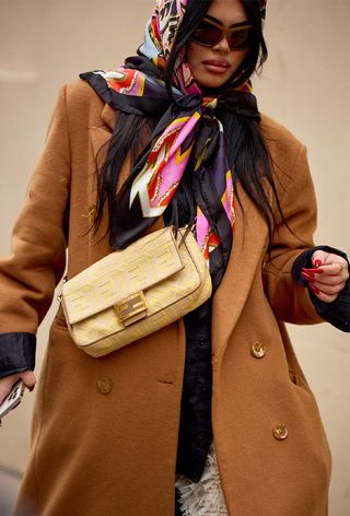 a photo showing how to style a designer scarf