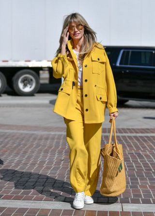 Heidi Klum wearing a yellow suit