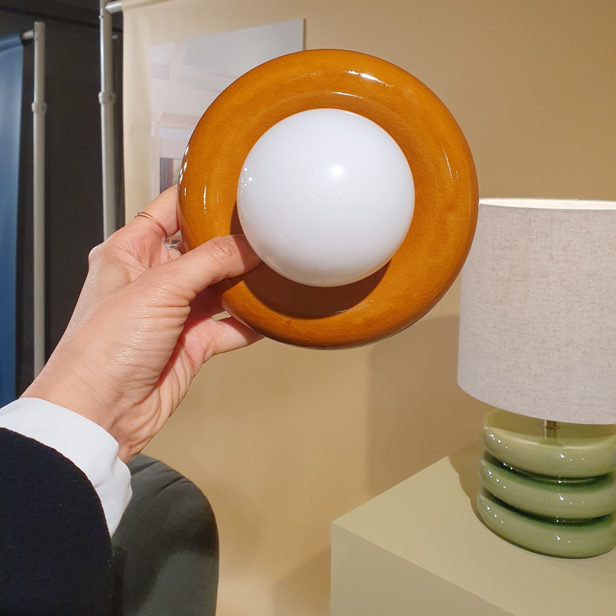 Me holding up the John Lewis donut lamp at the brand's spring/summer 2026 press show