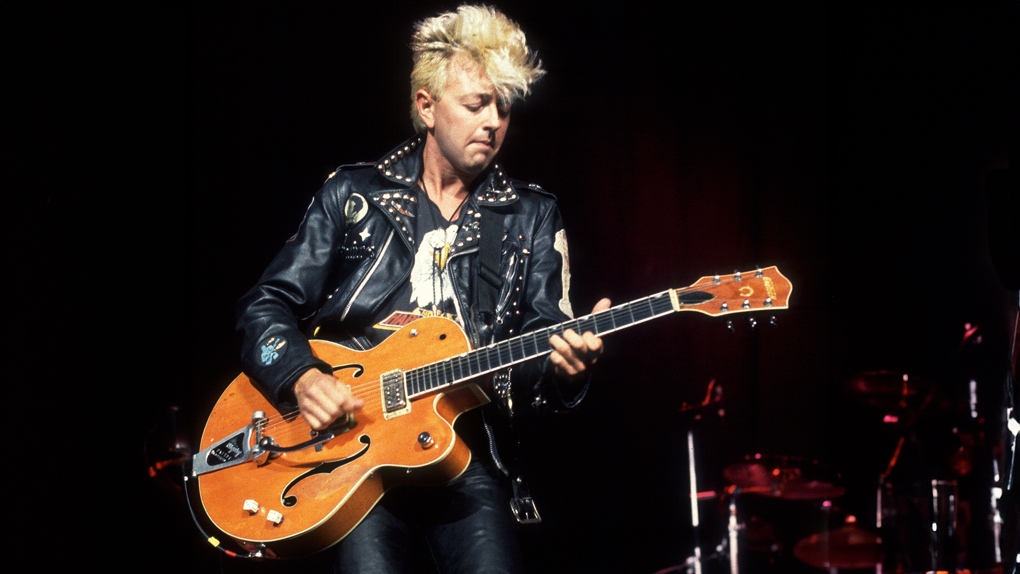 American Rockabilly and Rock musician Brian Setzer, of the group Stray Cats, plays guitar as he performs onstage at the Marcus Amphitheater, Milwaukee, Wisconsin, July 1, 1988.