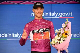 BERGAMO ITALY MAY 21 Jonathan Milan of Italy and Team Bahrain Victorious Purple Points Jersey celebrates at podium during the 106th Giro dItalia 2023 Stage 15 a 195km stage from Seregno to Bergamo UCIWT on May 21 2023 in Bergamo Italy Photo by Stuart FranklinGetty Images