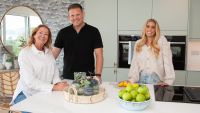 Stacey Solomon with couple Jo and Daryll in their new kitchen