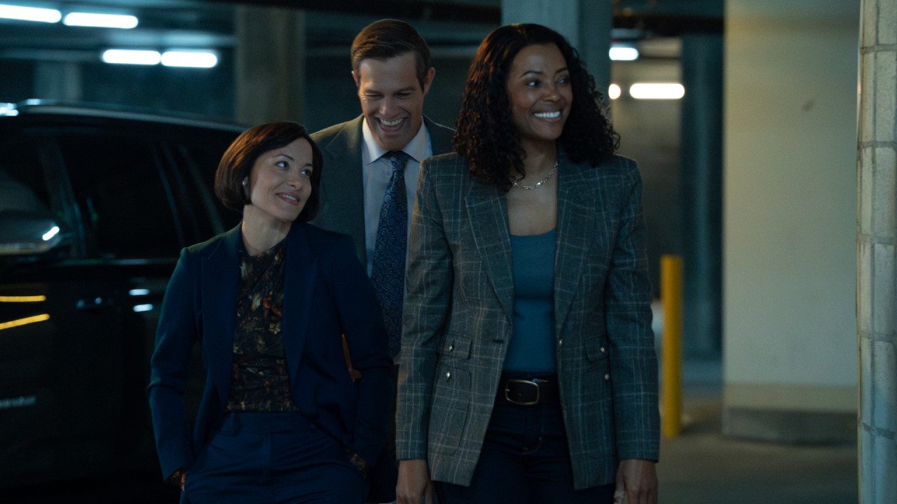 Rebecca and Tara smiling in the parking garage.