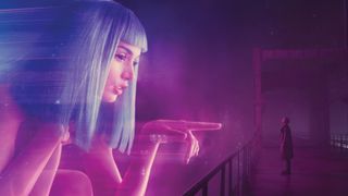 Blade Runner 2049 still of K and giant hologram Joi