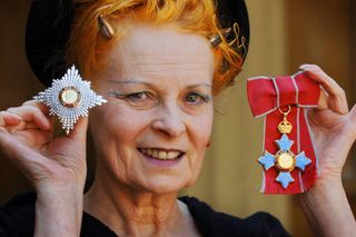 British Fashion designer Dame Vivienne Westwood poses for photographers after collecting her ensignia from the Prince of Wales during an Investiture ceremony at Buckingham Palace in London, 09 June 2006. The designer, who was largely responsible for anti-establishment punk fashion, is known for her subversive and eccentric take on traditional British style. She caused a stir on her previous visit to the Palace in 1992 when she collected her OBE from the Queen wearing no knickers.