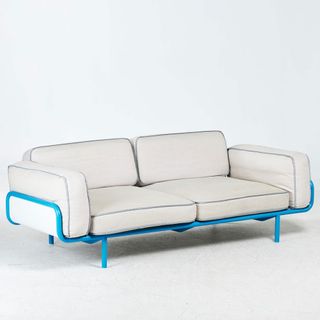 White sofa with blue metal frame