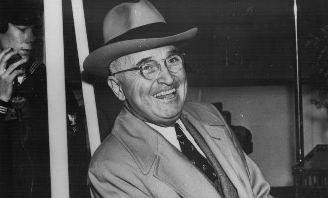 Truman laughing on board the Williamsburg in 1950, bound for Florida on vacation.