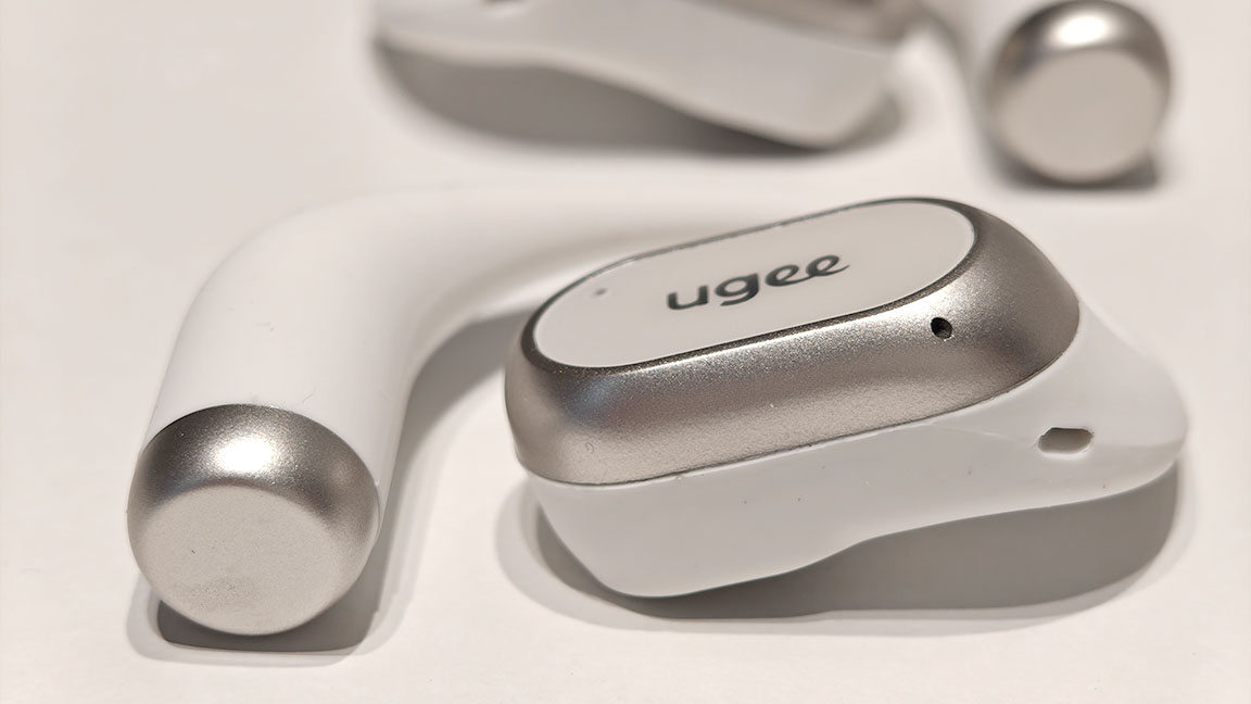 Ugee FreSound; open earbuds on a white table