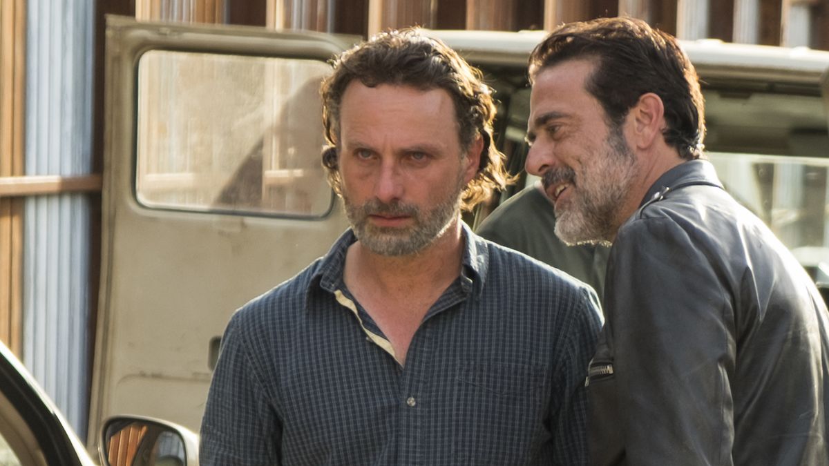 Negan grinning in Rick&#039;s angry face as he walks away in The Walking Dead