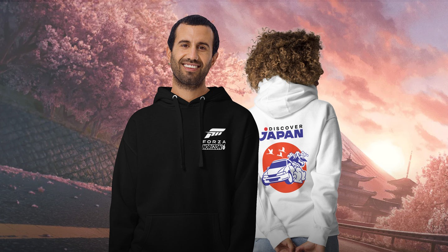 Two people wear hoodies: one in black with a "Forza Horizon 5" logo, the other in white with a "Discover Japan" design.