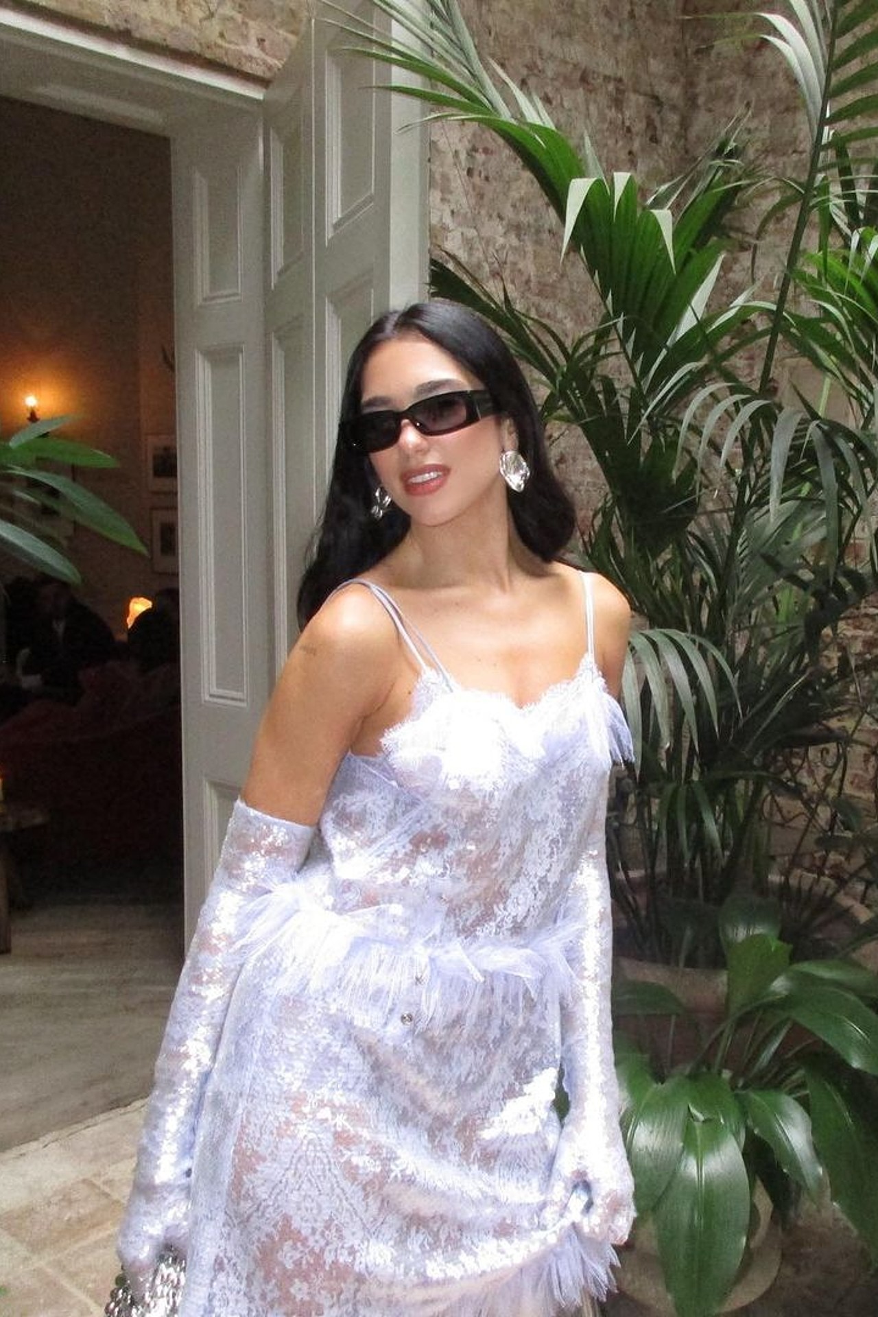 Dua Lipa attends a wedding