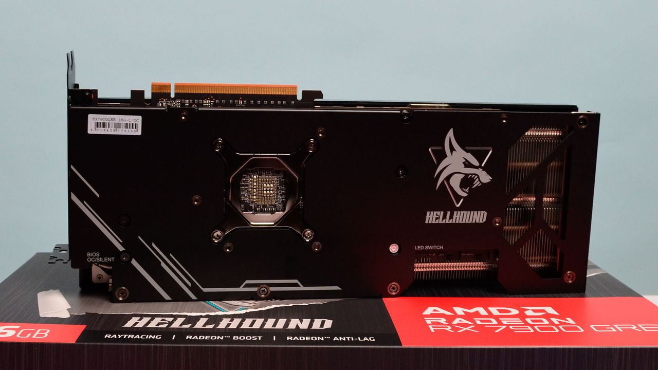 An AMD Radeon RX 7900 GRE from PowerColor on a desk with its retail packaging