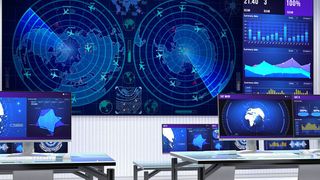 A control room with bright blue LED screens monitoring activities with Hiperwall 8.0 software.