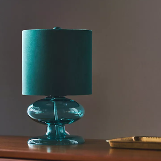 blue glass table lamp with sculptural base