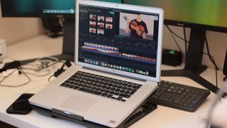 Best laptops for video editing: MacBook on a desk with video editing software open