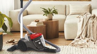 A Hoover breeze vacuum cleaner in a modern living room 