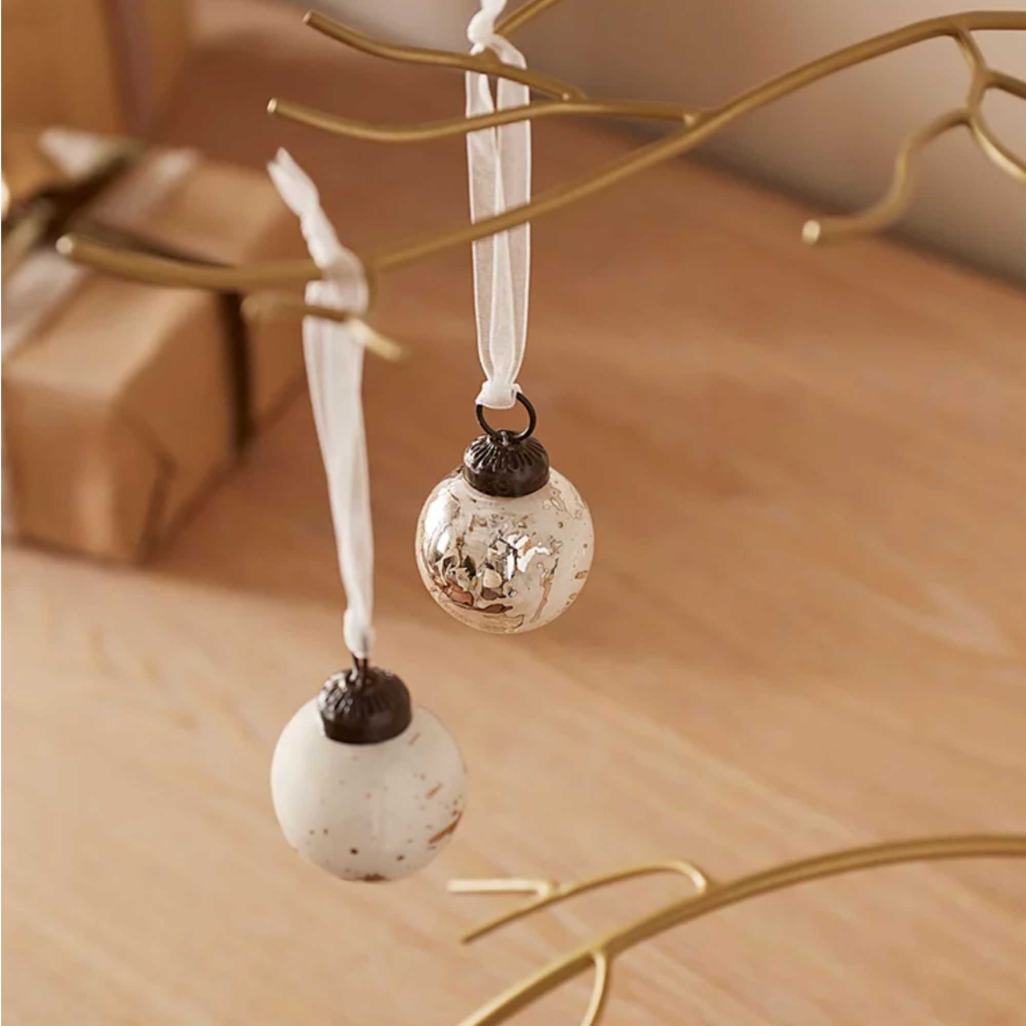Christmas tree gold decoration branches with mini white baubles