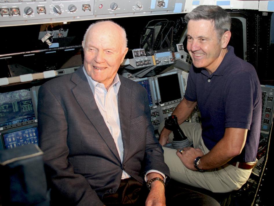 John Glenn and Bob Cabana on the flight deck of the space shuttle Discovery.