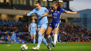 Lucy Bronze of Manchester City Women battles for possession with Guro Reiten of Chelsea Women