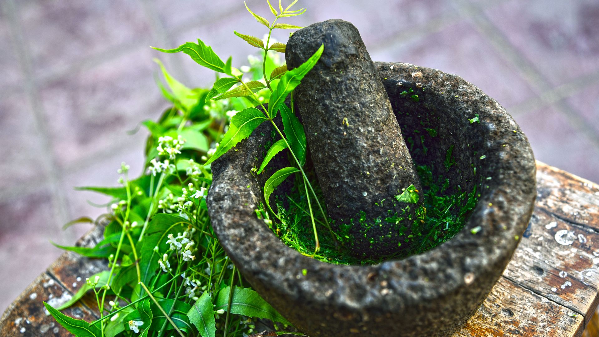 Herbs being ground for an ayurvedic treatment