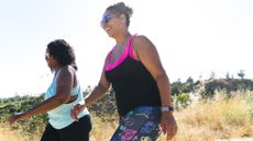Two women walking outside