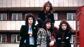 Queen posing outside a block of flats circa 1973